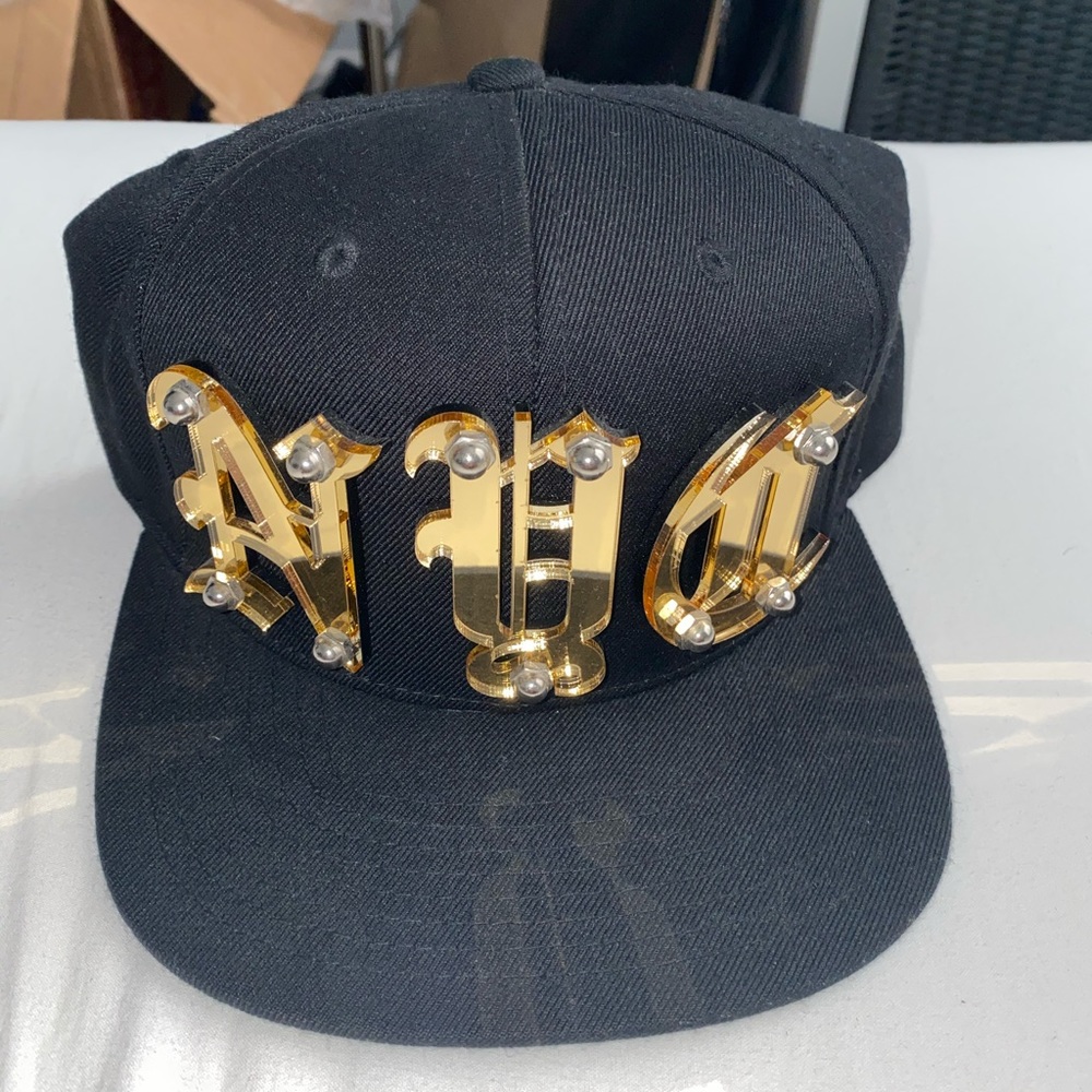 Snapback with gold letters. Brand new.